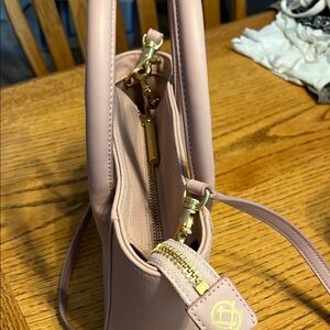 Pink Crossbody Bag with Gold Hardware and Structured Design